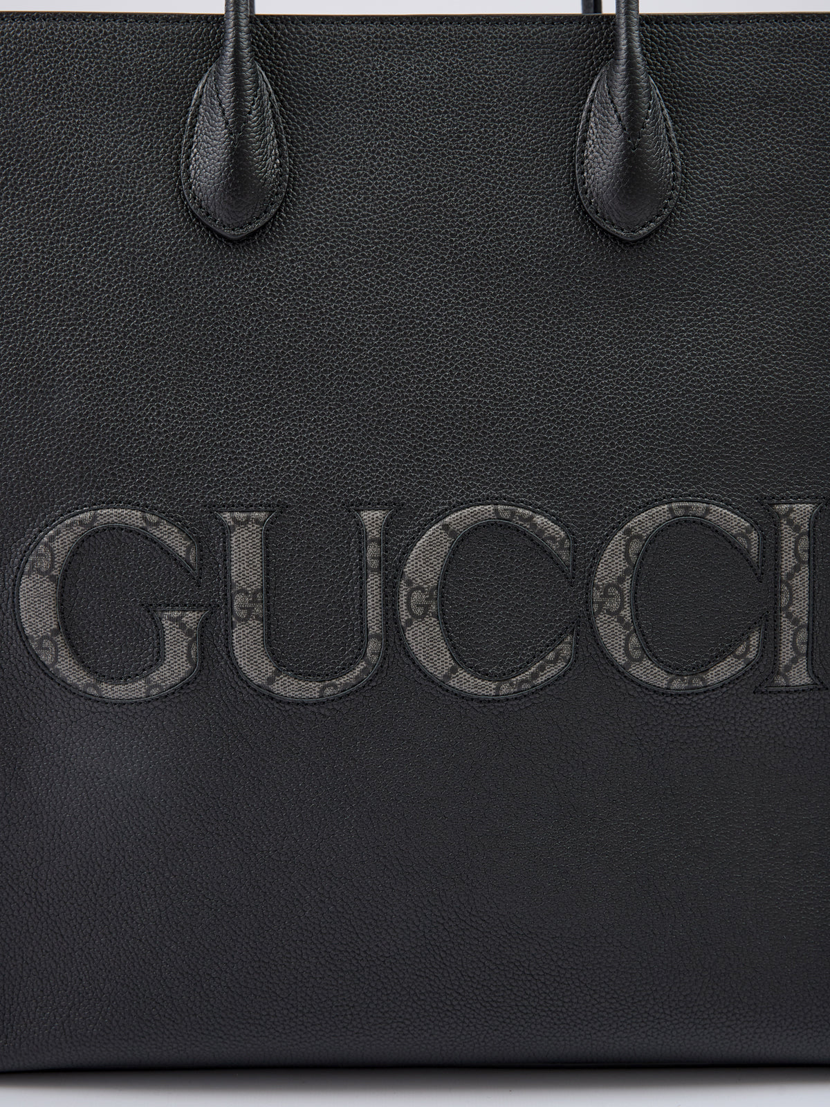 GUCCI Sac fourre-tout moyen en cuir noir avec logo